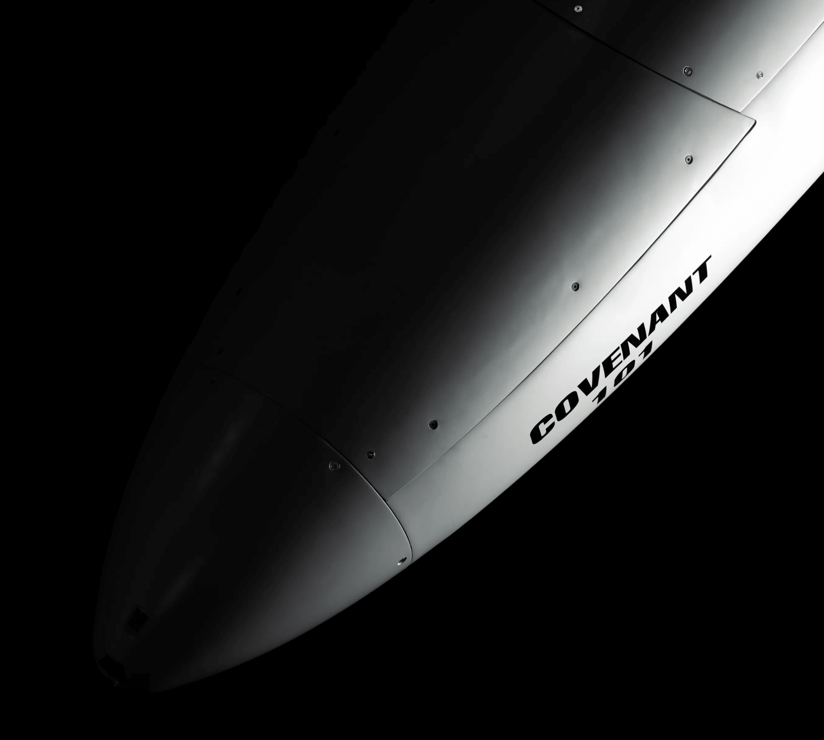 The nose of the Covenant airframe in close-up, COVENANT stencilled along its flank.